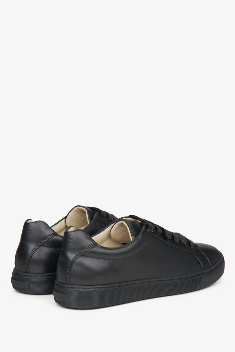 Estro black leather sneakers - close-up on the heel and side line of the shoes.