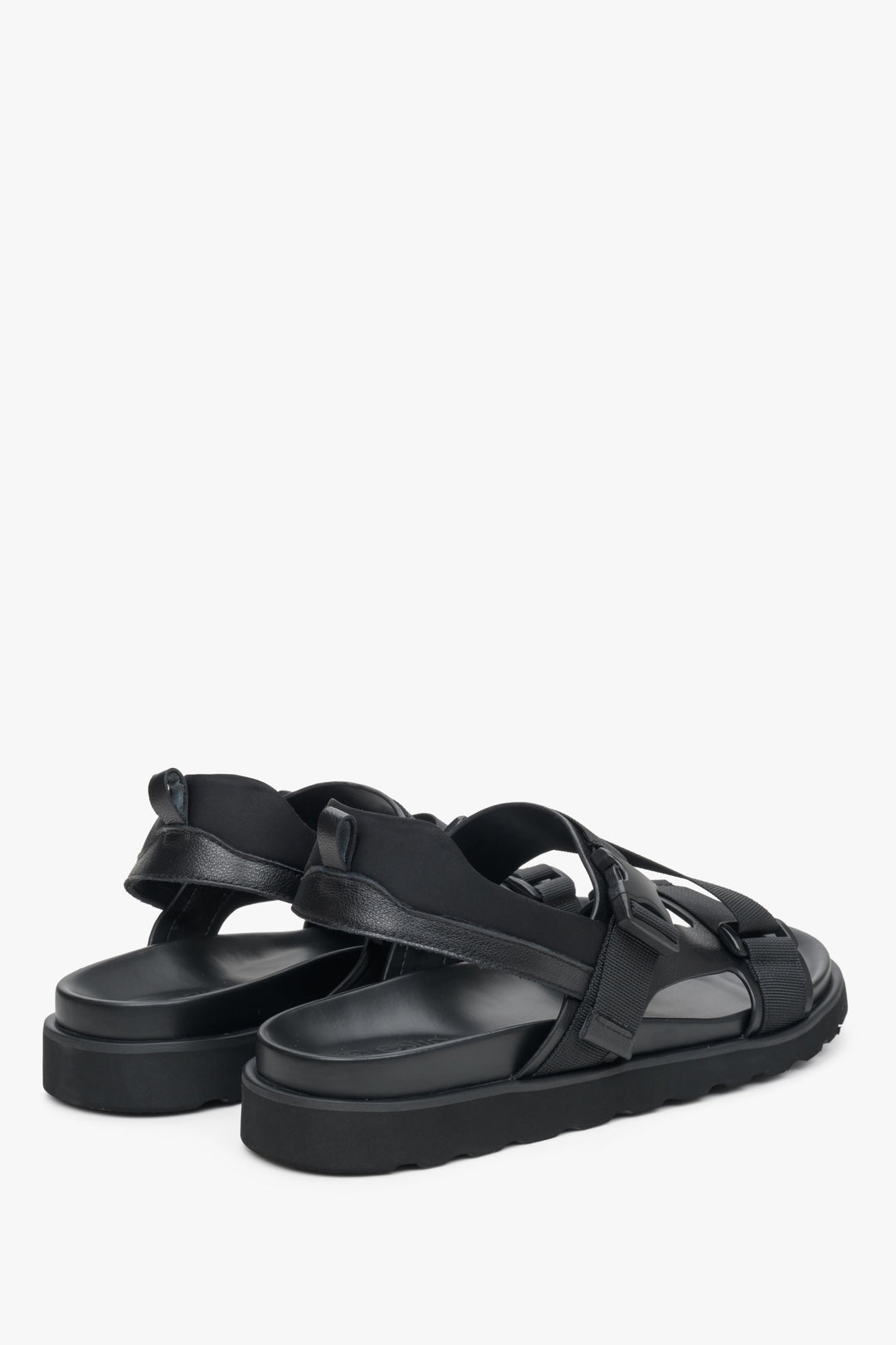 Men's black leather-textile summer sandals with thick straps - close-up on the heel and side line of the shoes.
