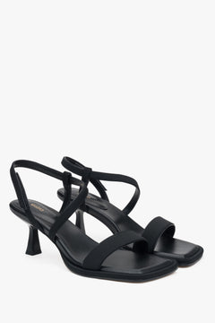 Elegant black Estro women's sandals, combining genuine leather and textiles, set on a stylish heel.