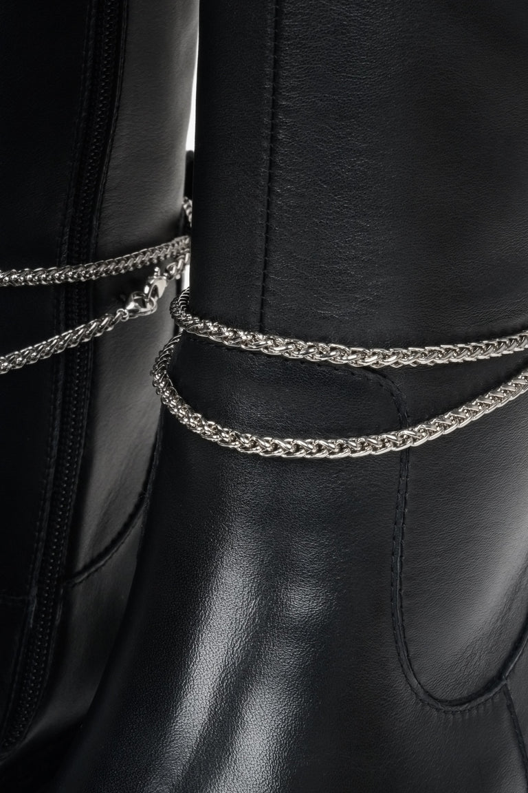 Winter women's boots in black made of genuine leather by Estro - close-up on the decorative detailing.