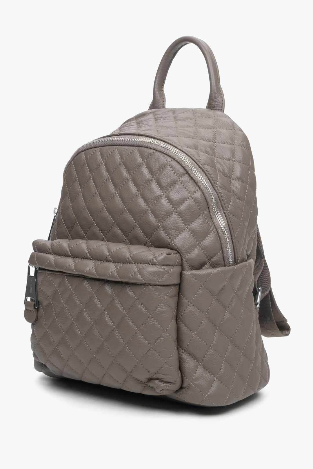 Dark grey quilted leather women's backpack by Estro - side view of the model.