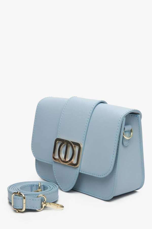 Blue leather women's handbag with gold accents by Estro.