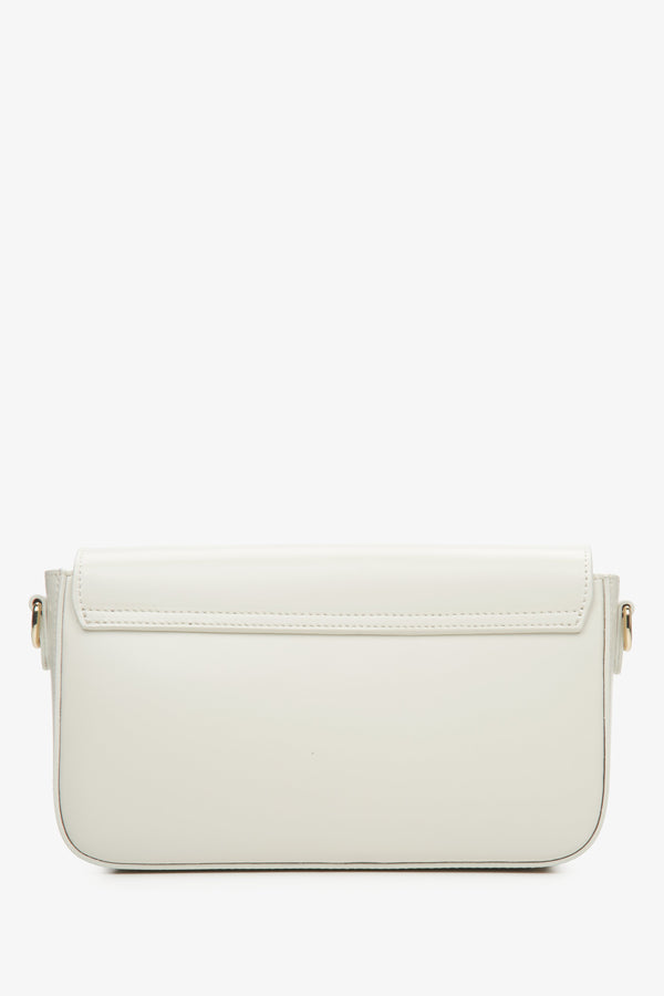 Small women's handbag in milky-beige, styled as a baguette.