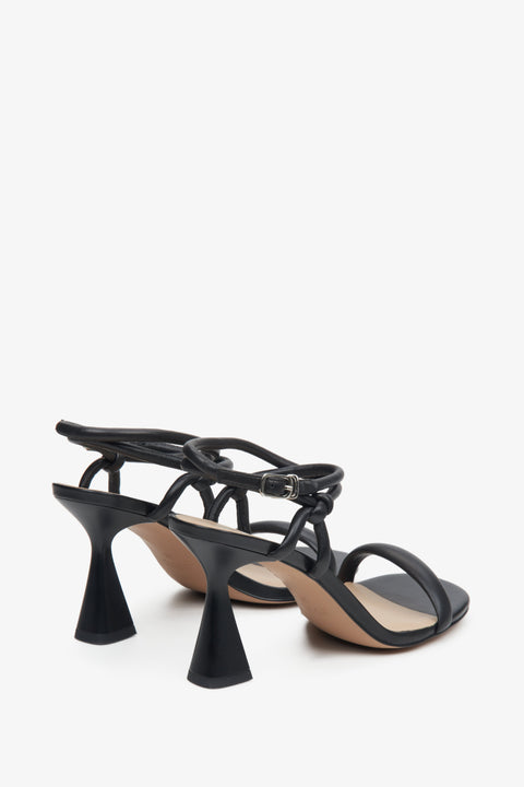 Women's black leather strappy heeled sandals Estro - a close-up on a funnel heel.