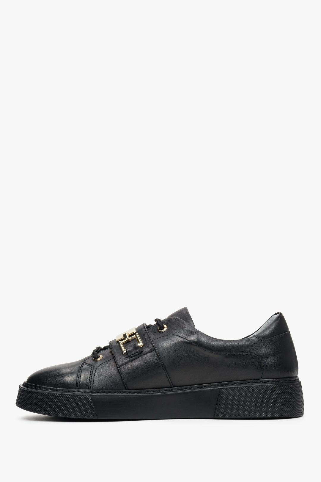 Women's black sneakers with a gold application by Estro - shoe profile.