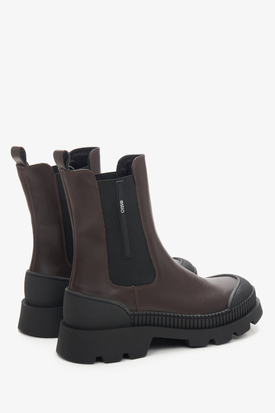 Brown-black Estro women's Chelsea boots made of genuine leather - close-up on the side seam and heel.