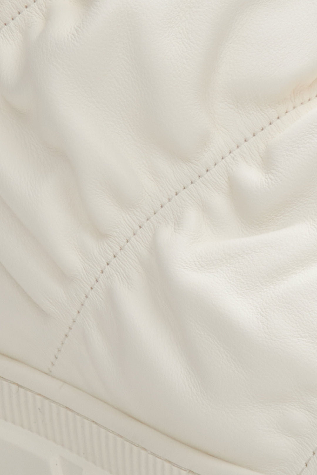 Light beige fur lined snow boots Estro - a close-up on details.