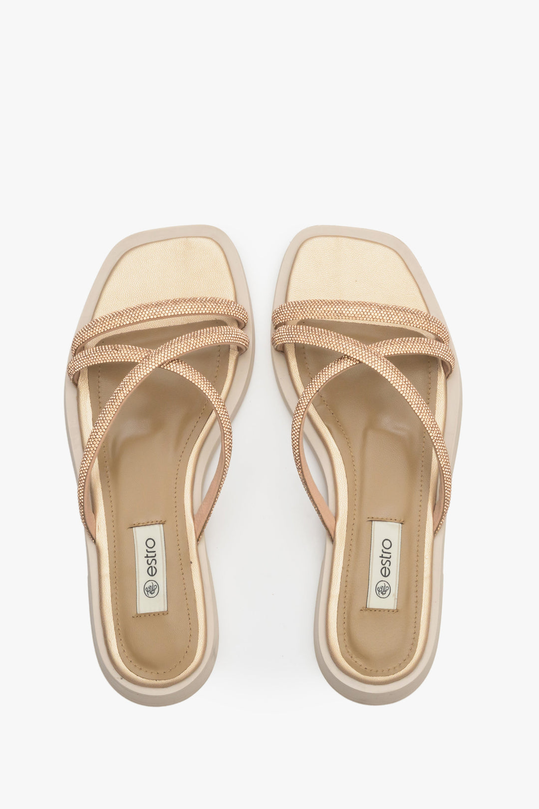 Comfy and stylish women's slide sandals on a flat heel by Estro in gold colour.