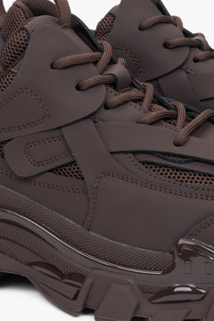 Women's sneakers in dark brown colour made of genuine leather and textile material for spring and autumn - close-up on the lacing system.