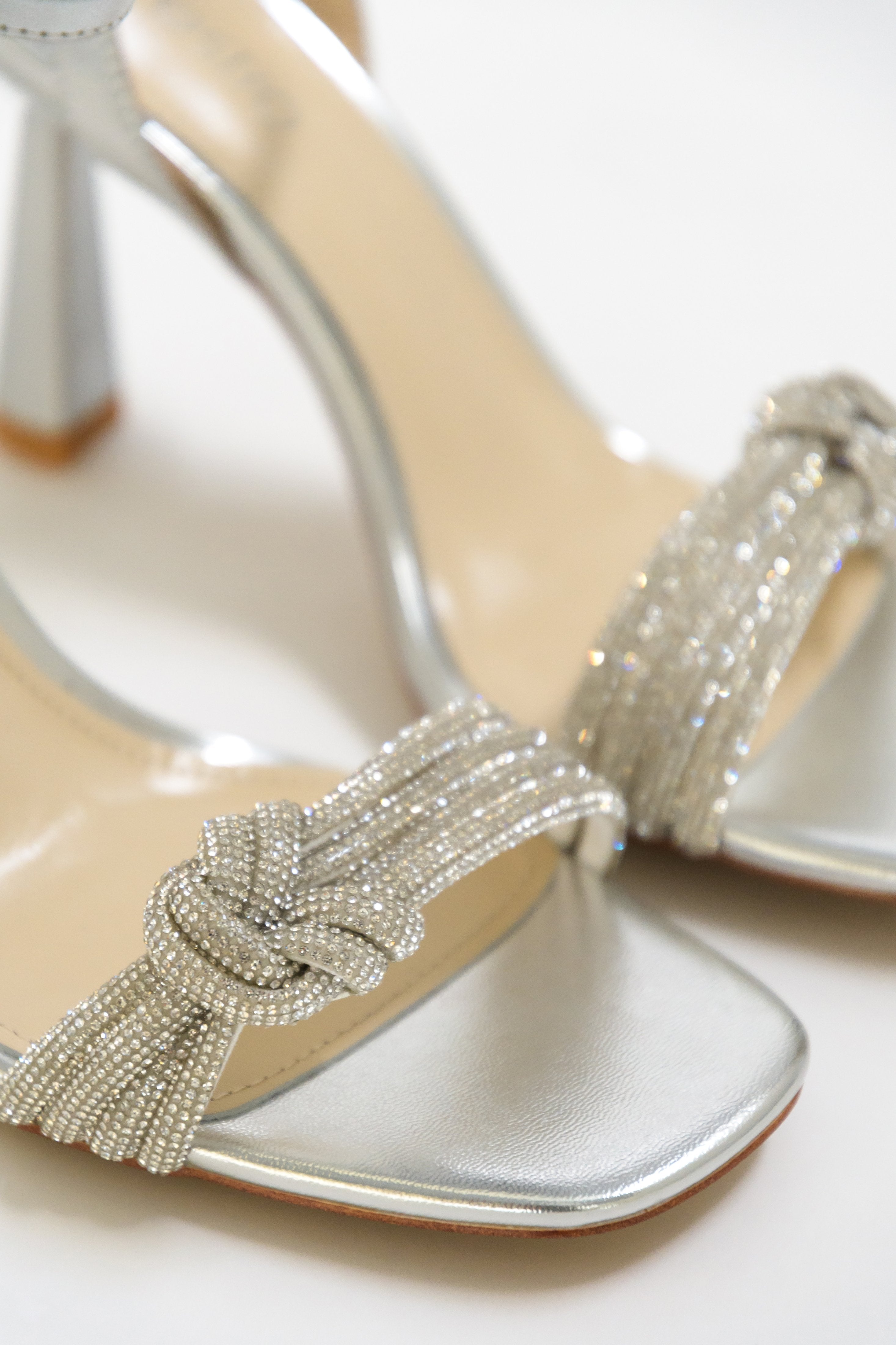 Estro silver women's sandals with silver rhinestones - close-up on the details.