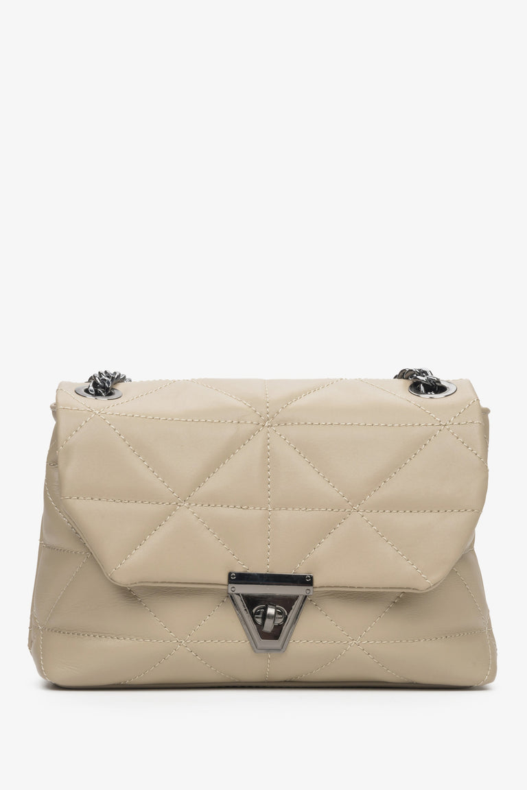 Beige quilted Estro women's handbag with silver accents.