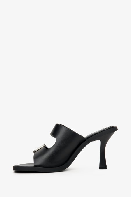 Women's black stiletto mules from Estro with a buckle - shoe profile.