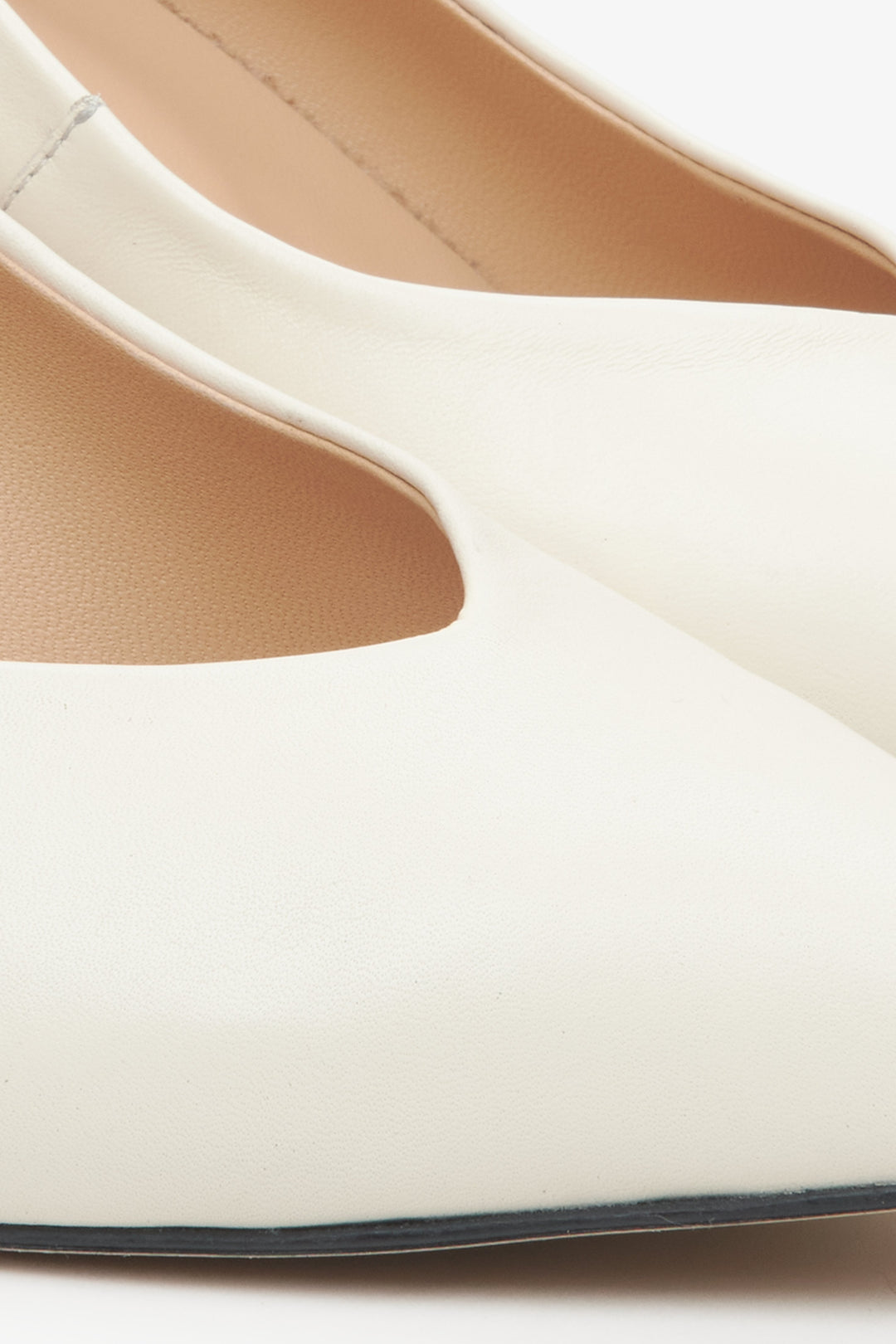 Women's cream-beige leather pumps - close-up on the detail.