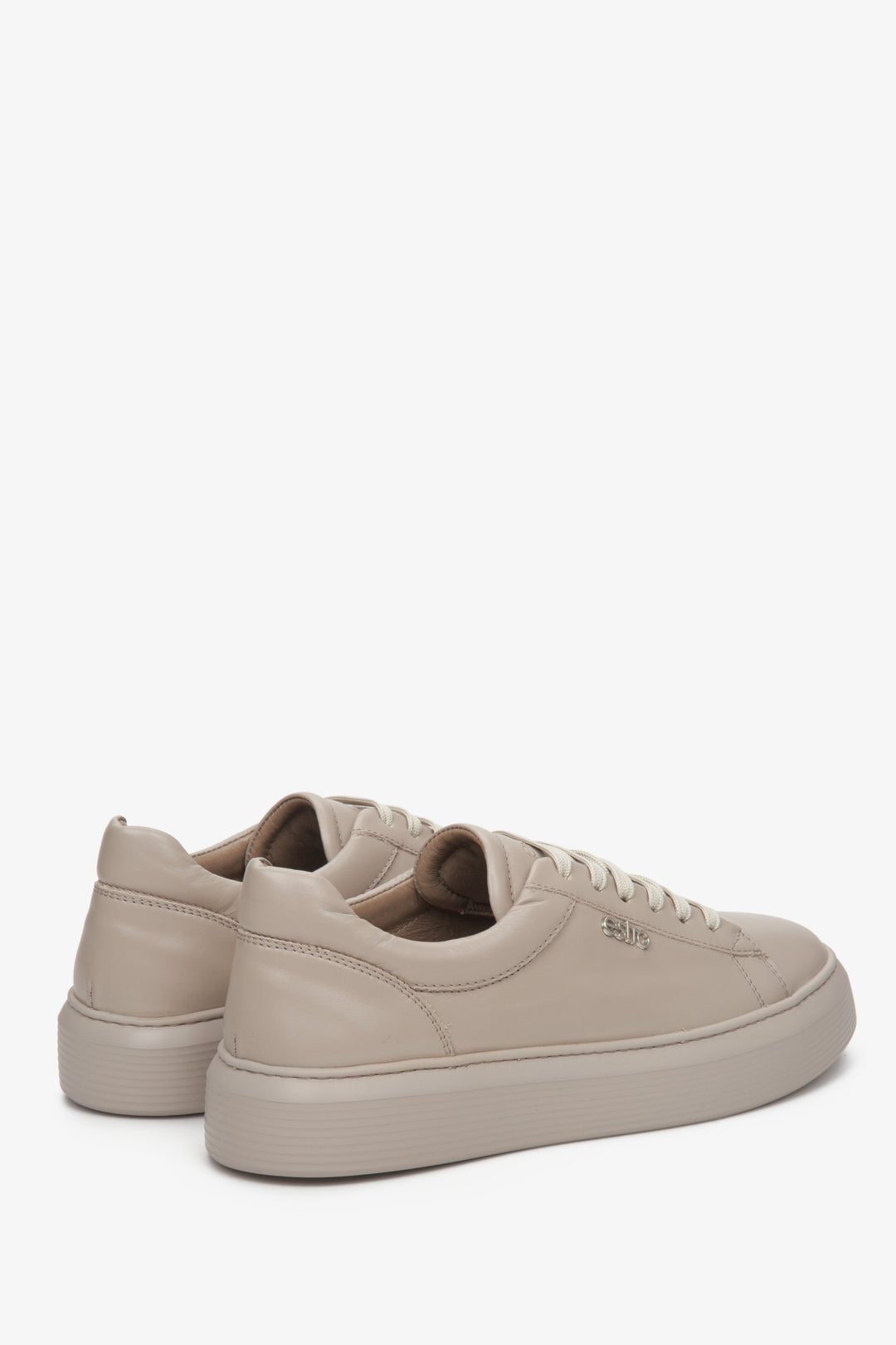 Women's beige sneakers by Estro - close-up of the heel and side seam of spring footwear.