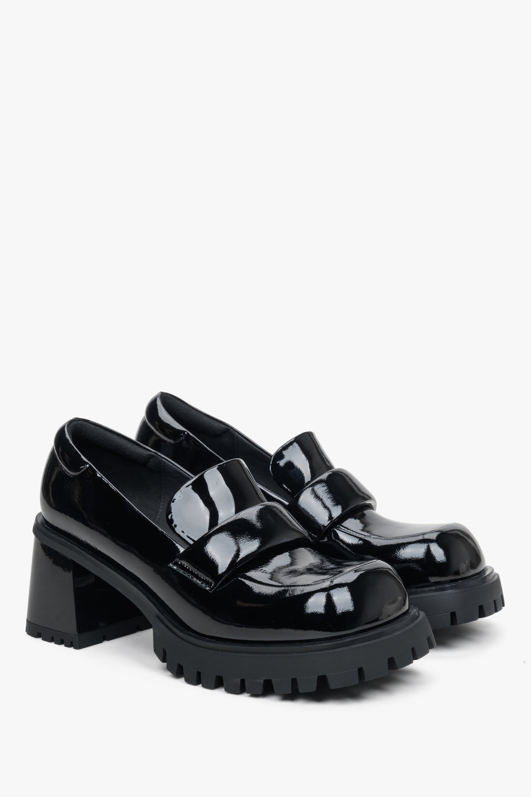 Women's black heeled loafers made of patent genuine leather by Estro.
