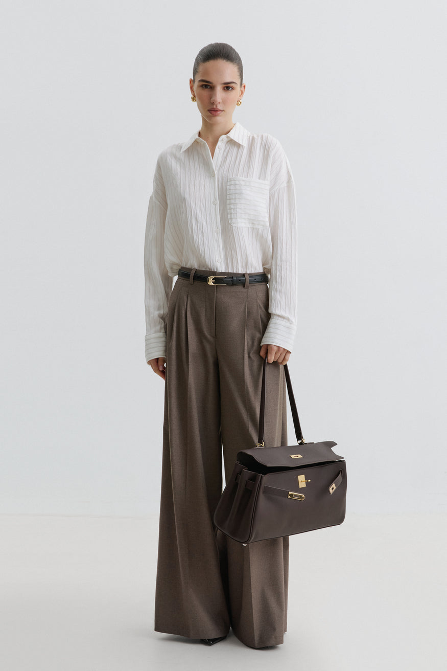 Women's saddle brown shoulder bag by Estro featuring gold-tone hardware.