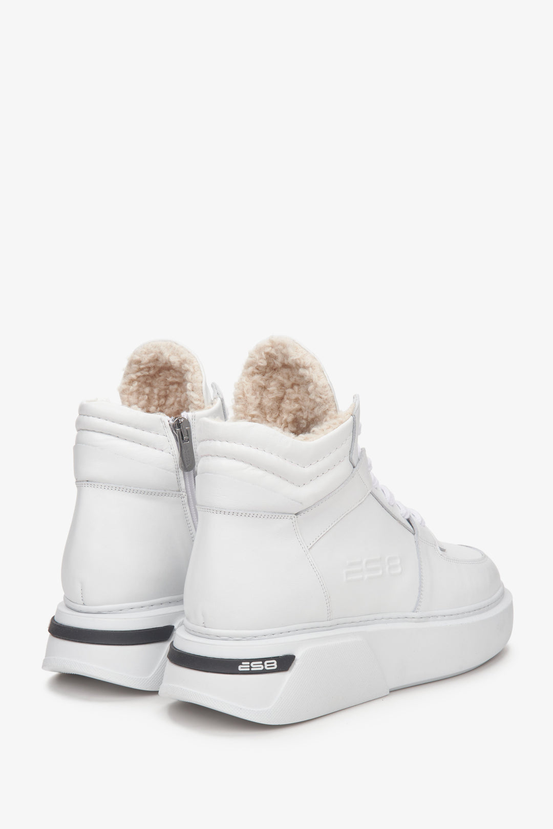 Women's high-top winter sneakers in white suede and leather - close-up on the heel and side profile of the model.