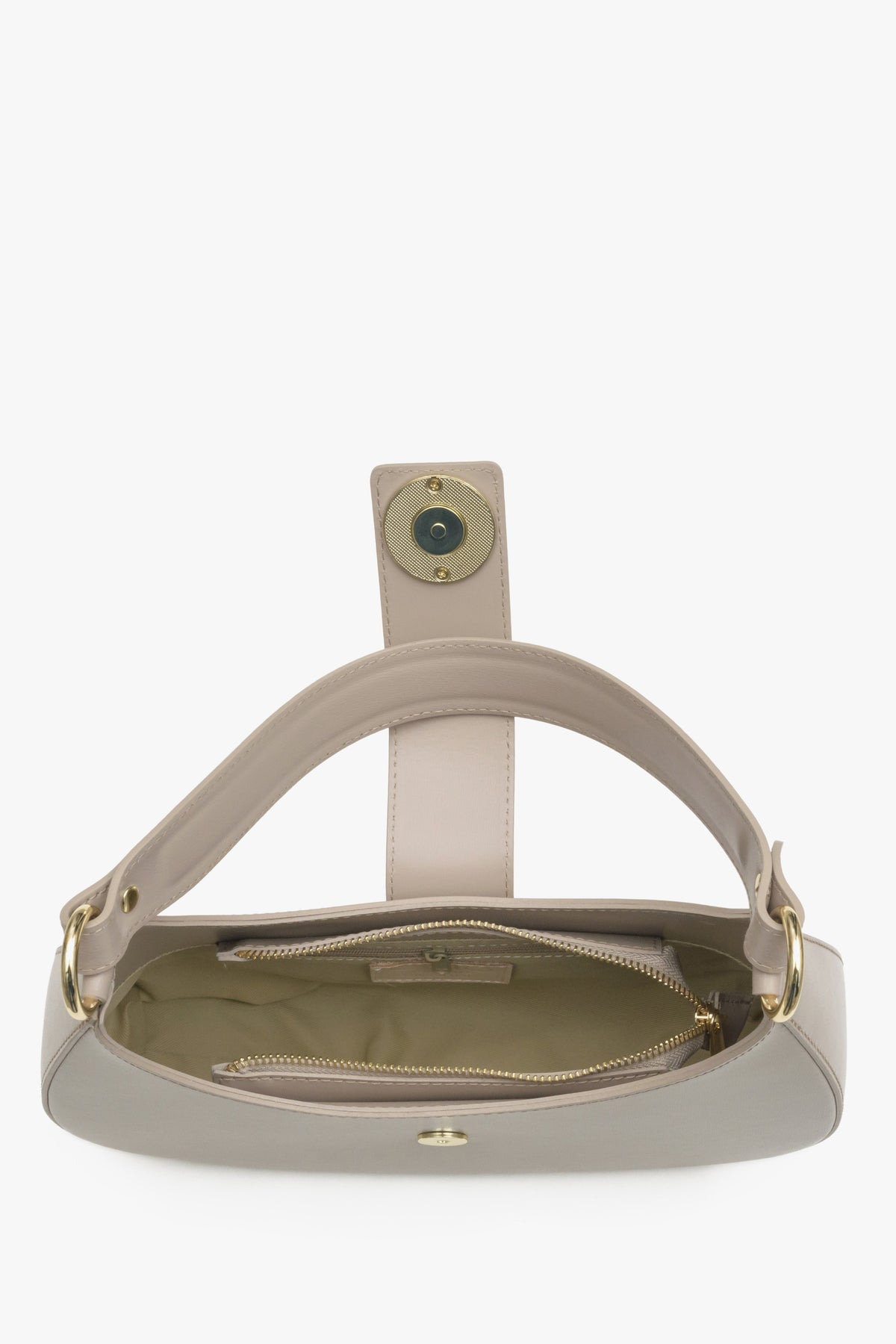 Interior presentation of a beige leather -style women's handbag.