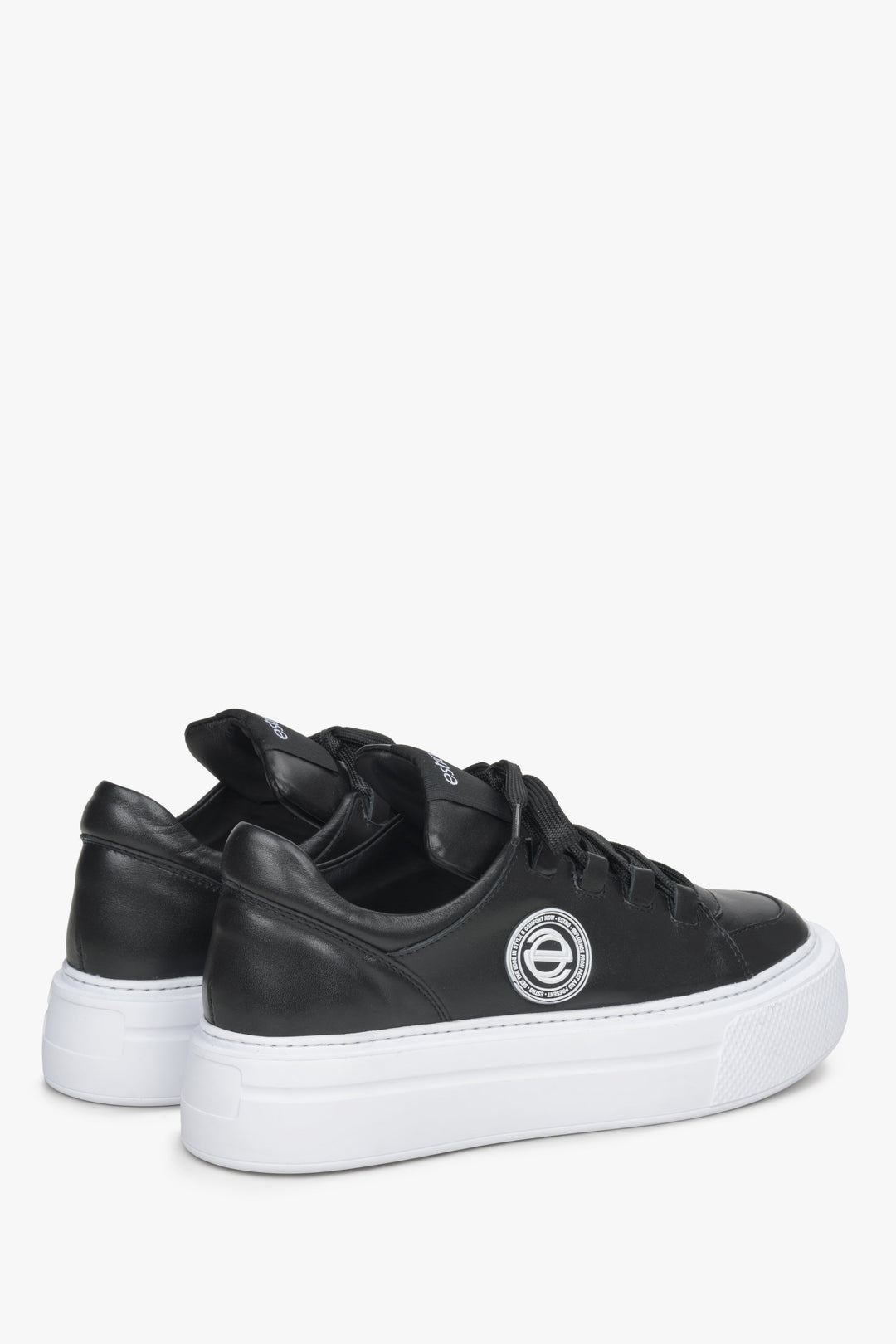 Estro black leather sneakers on a thick sole - close-up on the back.