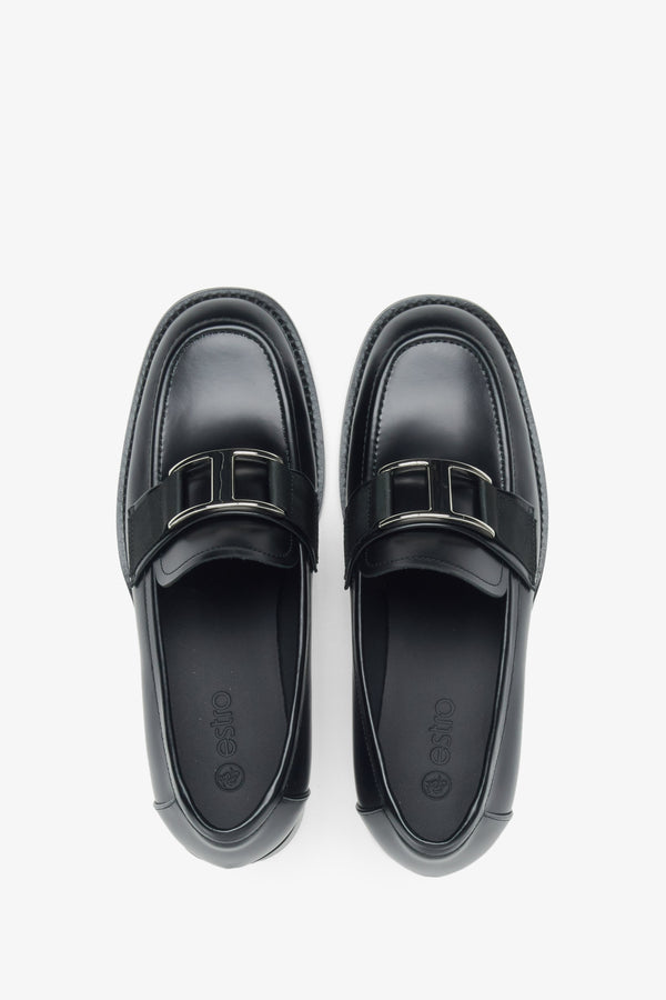 Estro black leather women's penny loafers with a decorative buckle - top view presentation.