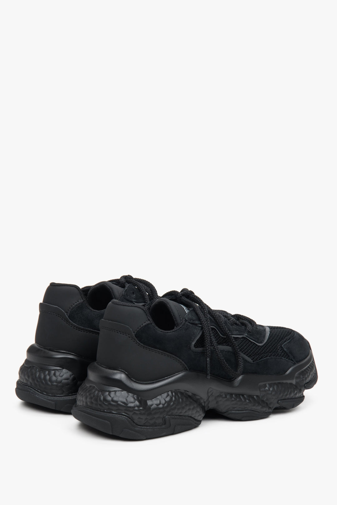 Black suede and textile women's sneakers ES 8 with lacing - close-up on the heel and side line of the shoes.