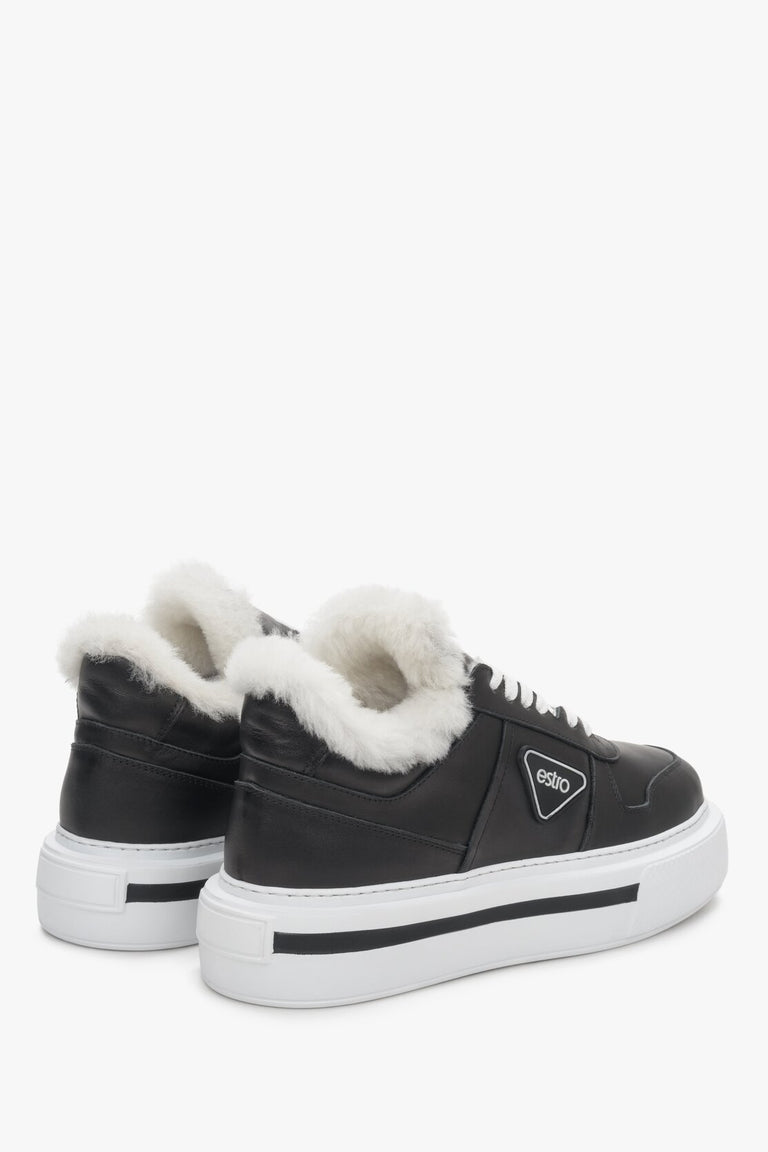 Black insulated women's sneakers made from genuine leather with fur lining.