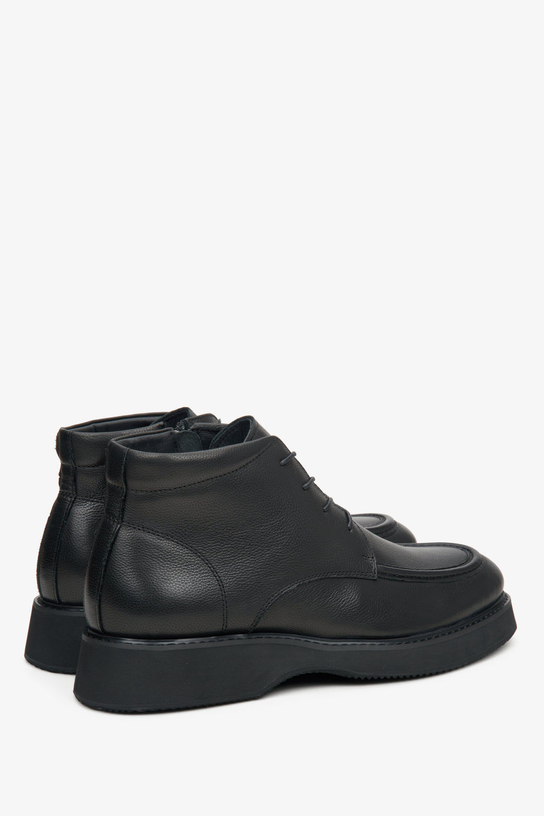 Men's black leather boots by Estro - close-up on the side line and heel counters.
