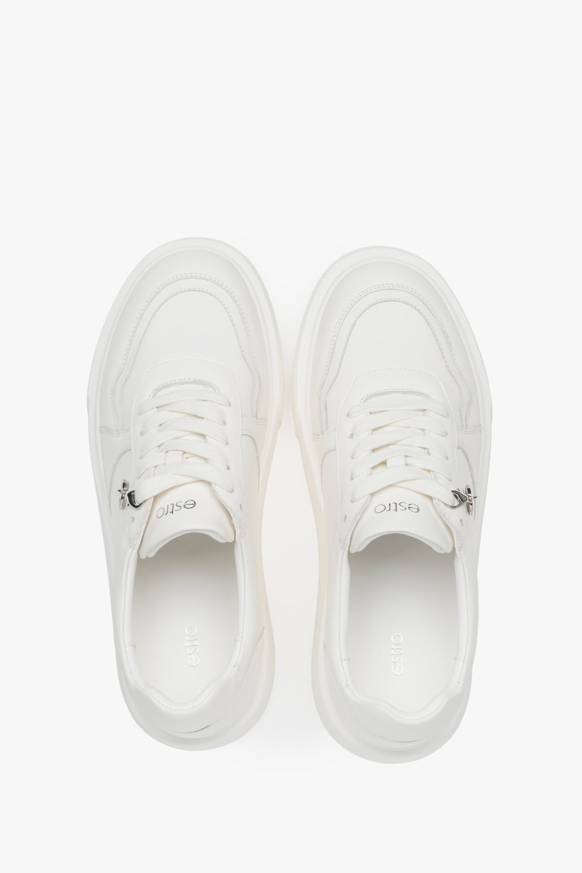 Lightweight white Estro women's sneakers made of genuine leather, with a flexible sole – a combination of freedom and trendy design.