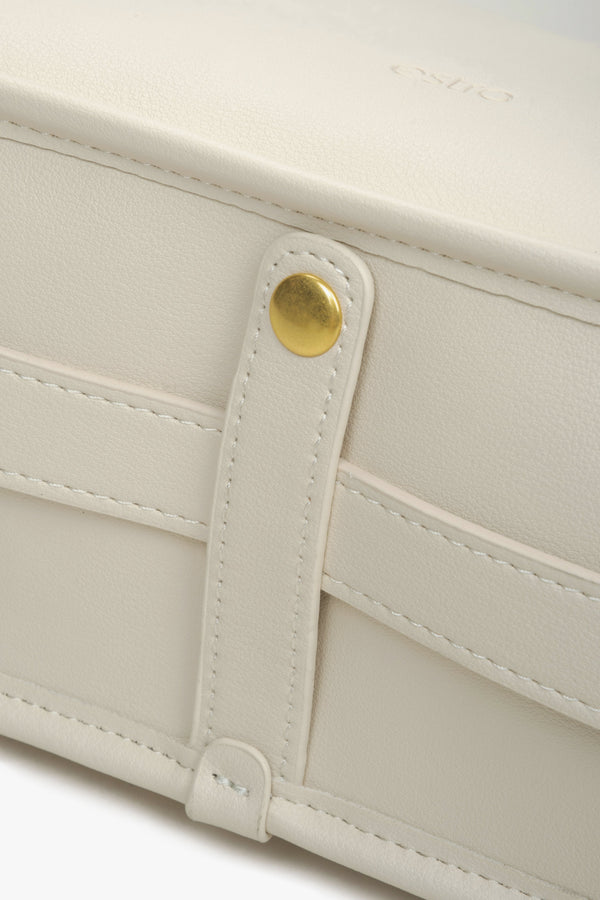 Women's light beige shoulder bag - a close-up on details.