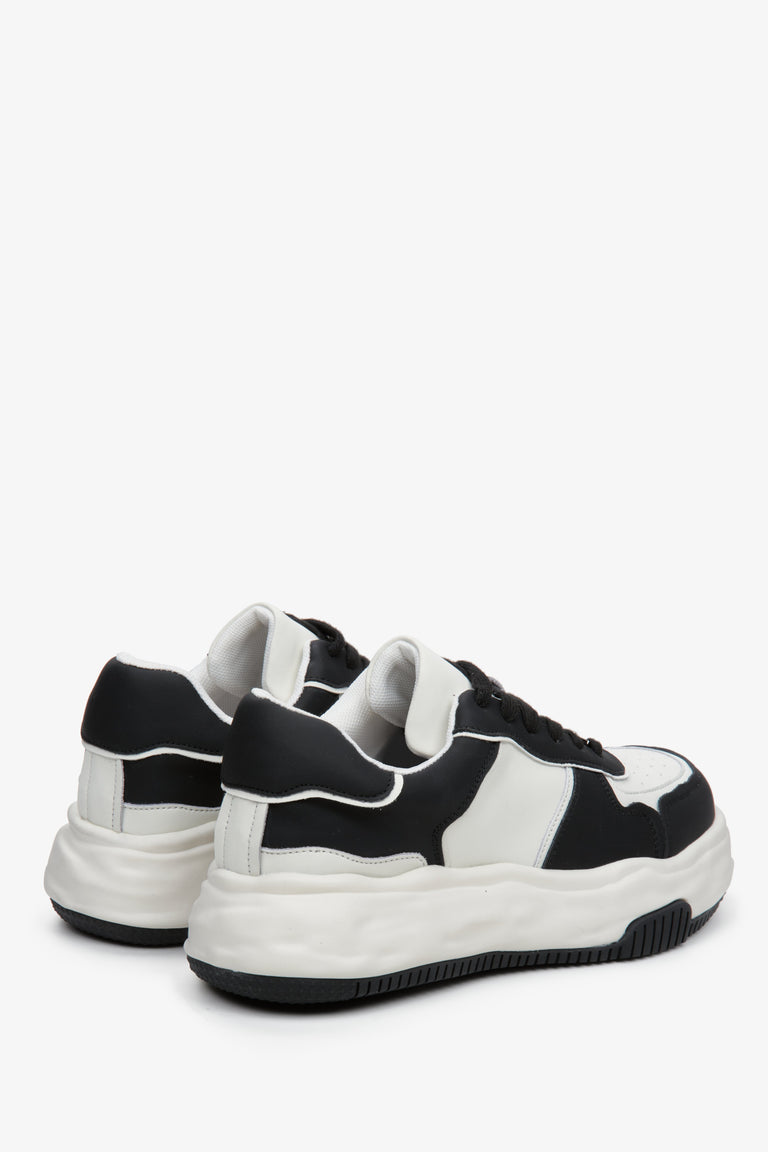 Leather, black and white sneakers by Estro - close-up on the heel and side stripe of the shoes.