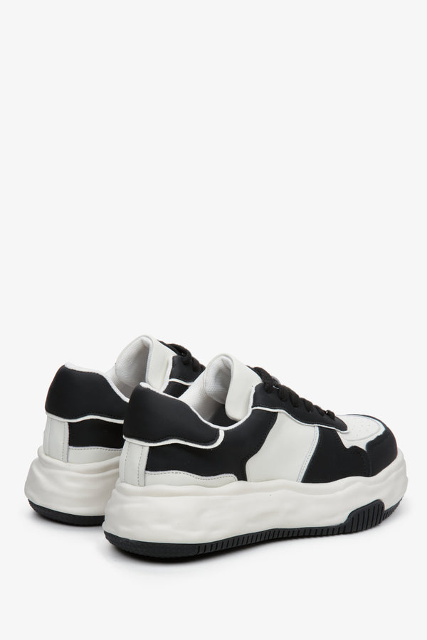 Leather, black and white sneakers by Estro - close-up on the heel and side stripe of the shoes.