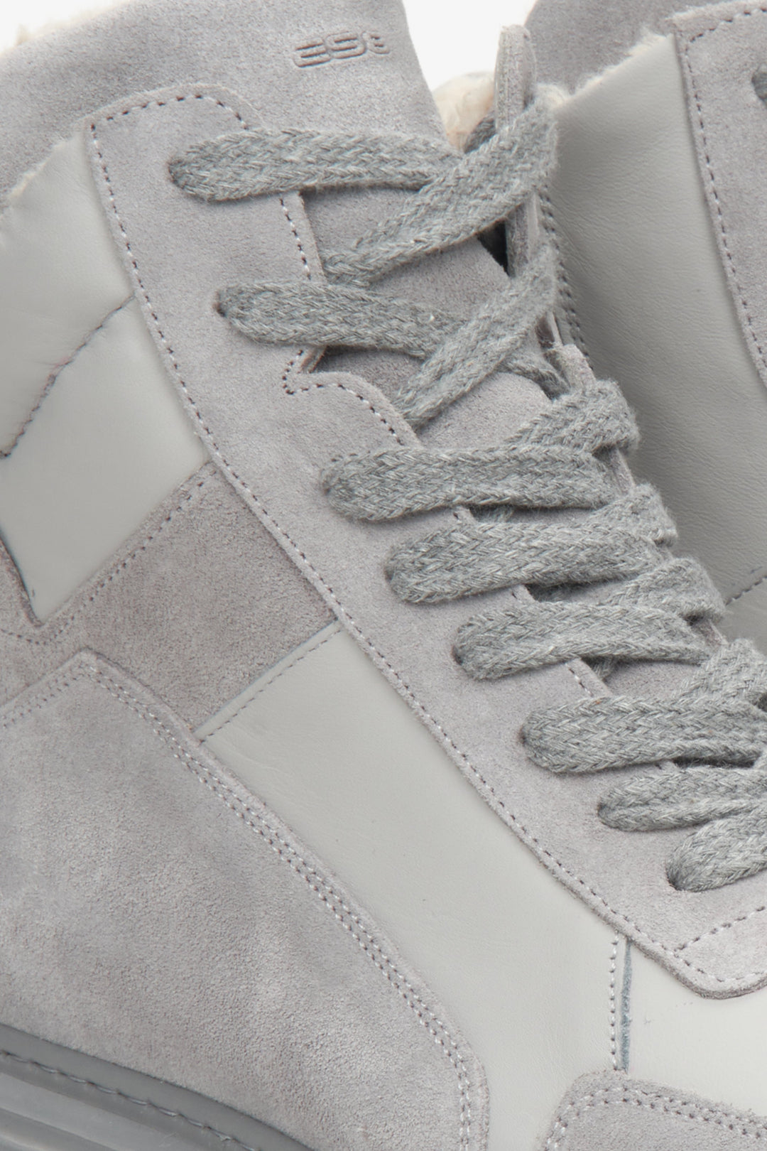 Winter women's sneakers in grey - a close-up on details.