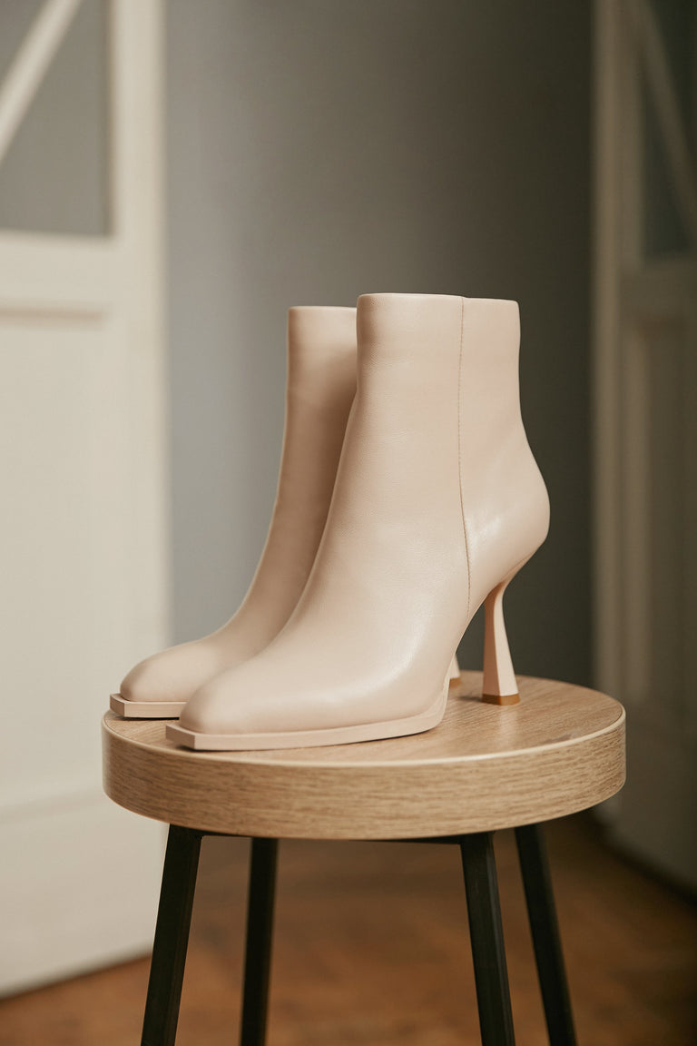 Women's beige high stiletto heel boots by Estro.