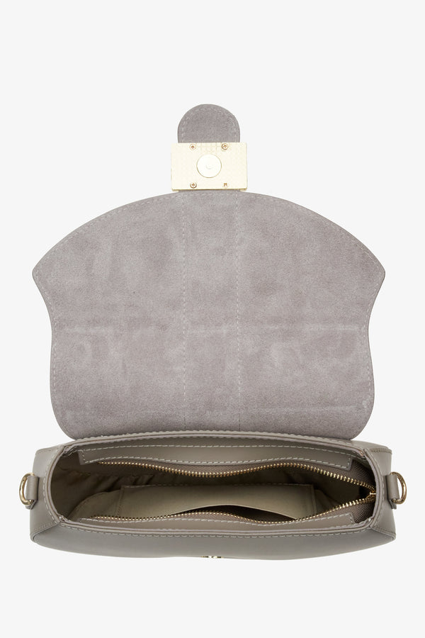 Women's grey leather handbag handmade in Italy - a close-up on bag's compartment.