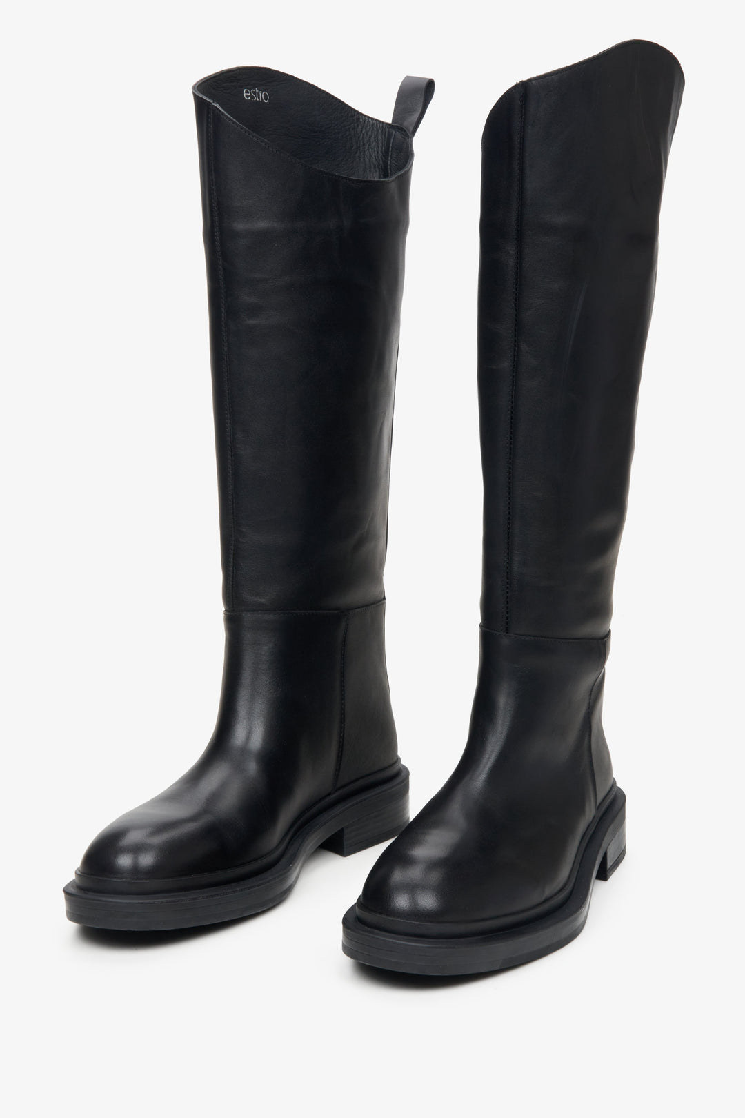 Women's black leather knee-high boots.