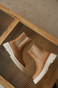 Stylish, women's brown leather ankle boots for fall by Estro.