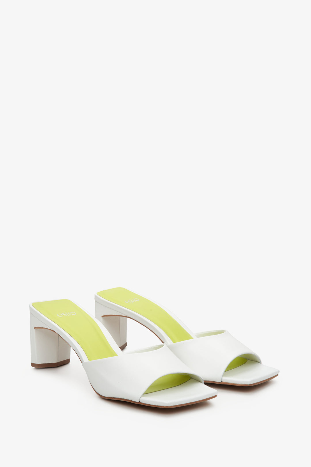 Women's white leather mules with a sturdy block heel by Estro - close-up on the shoe's toe.