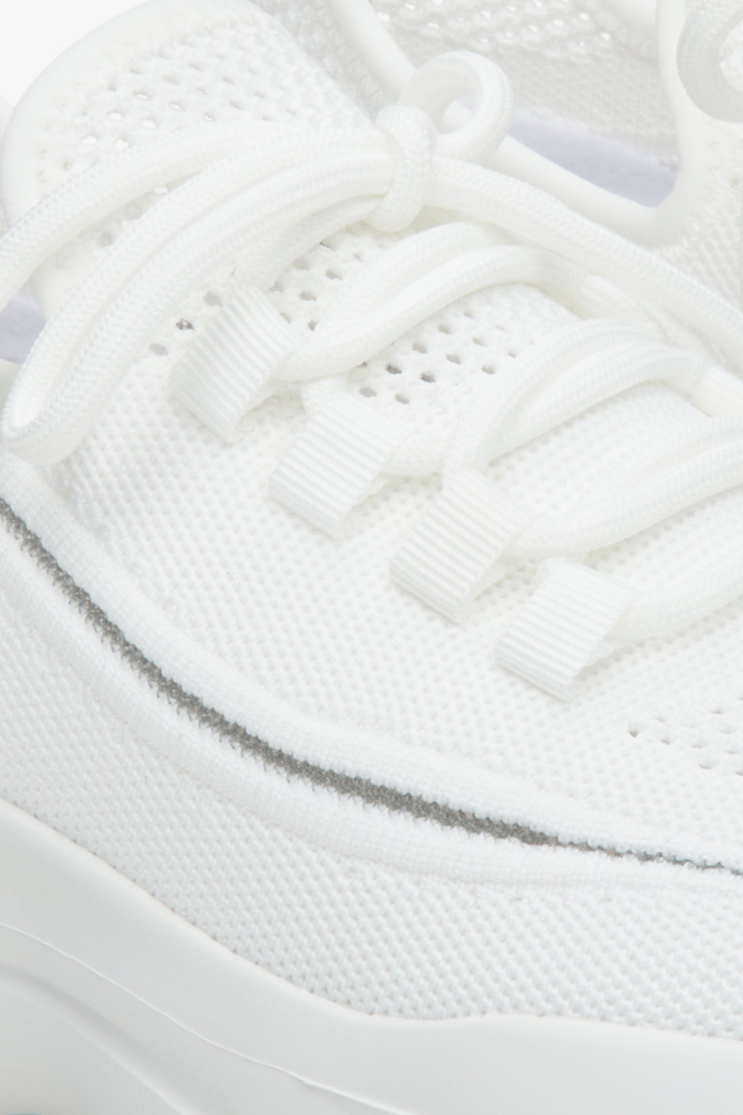 Women's white mesh and textile sneakers - a close-up on details.