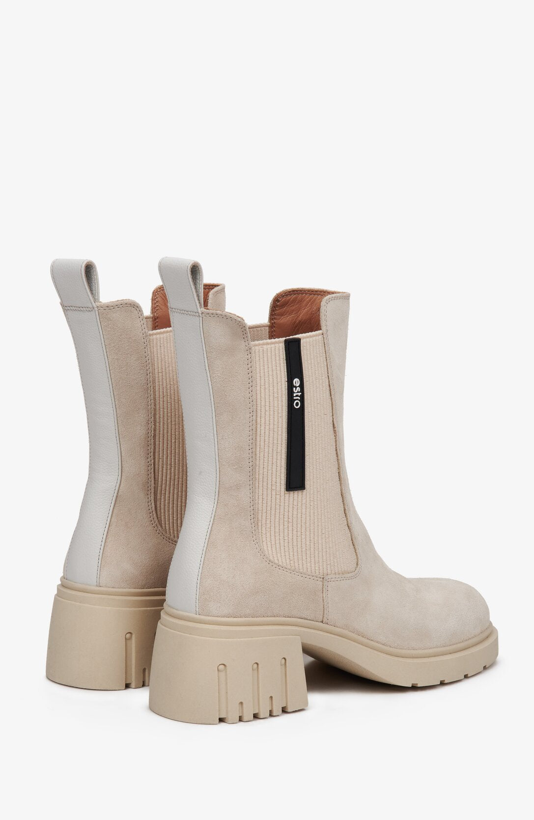 Women's beige suede high-heeled Chelsea boots for fall by Estro - close-up on a heel counter.