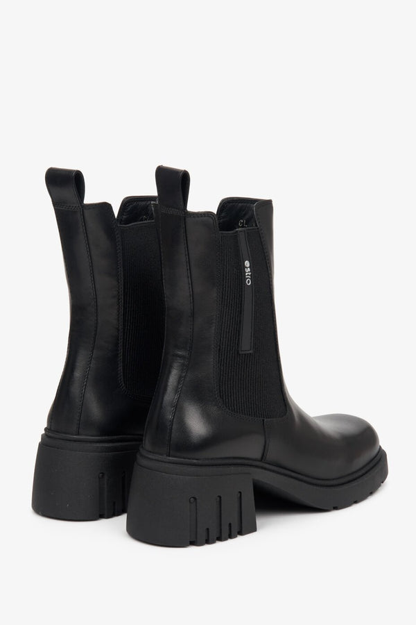 Women's black high-heeled Chelsea boots for fall by Estro - close-up on a heel counter.