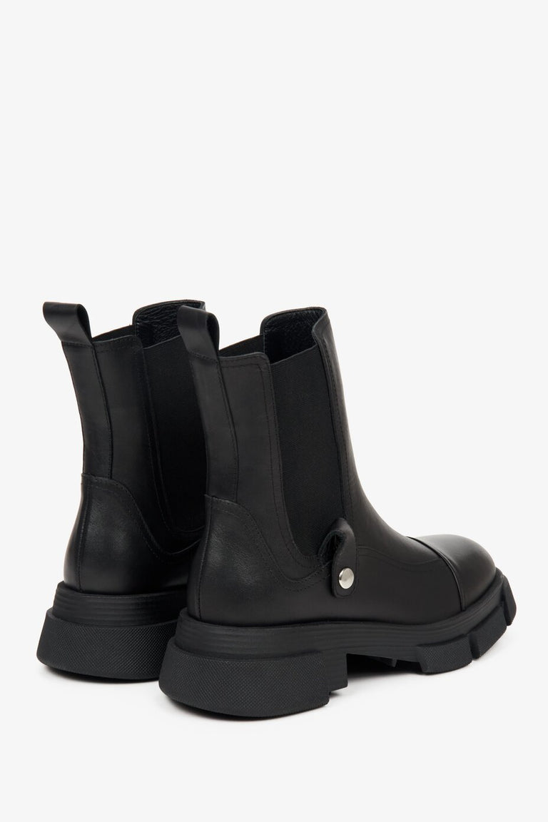 Women's black leather Chelsea boots - close-up of the side and heel lines of the boots.