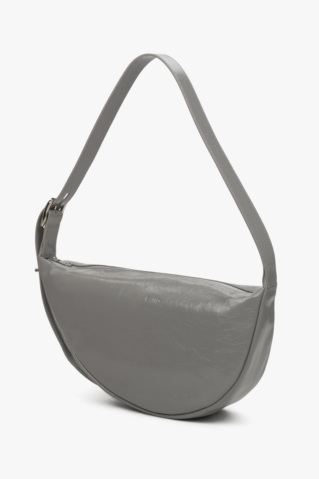 Women's grey leather Estro handbag - front view of the model.