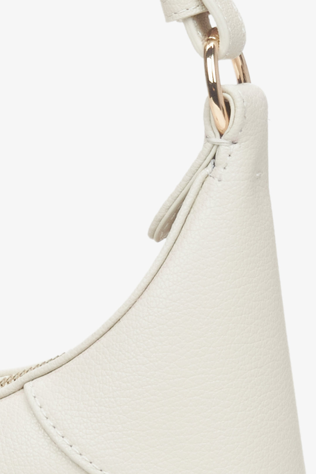 Women's cream beige leather handbag - a close-up on details.
