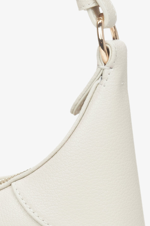 Women's cream beige leather handbag - a close-up on details.
