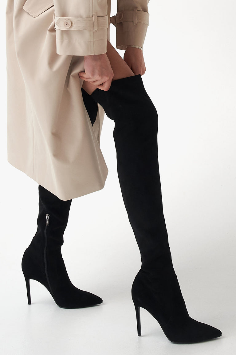 Black high women's velvet boots by Estro - footwear presentation on a model.