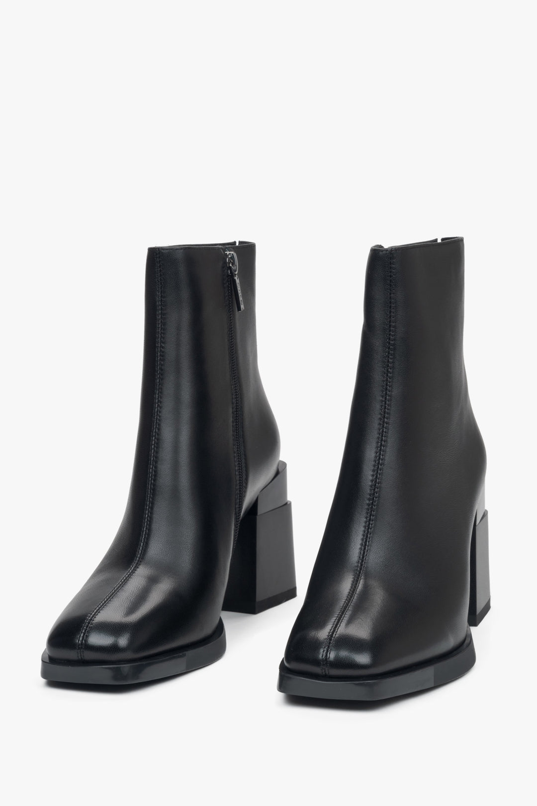 Women's black ankle boots made of genuine leather with a block heel and light insulation - front view.