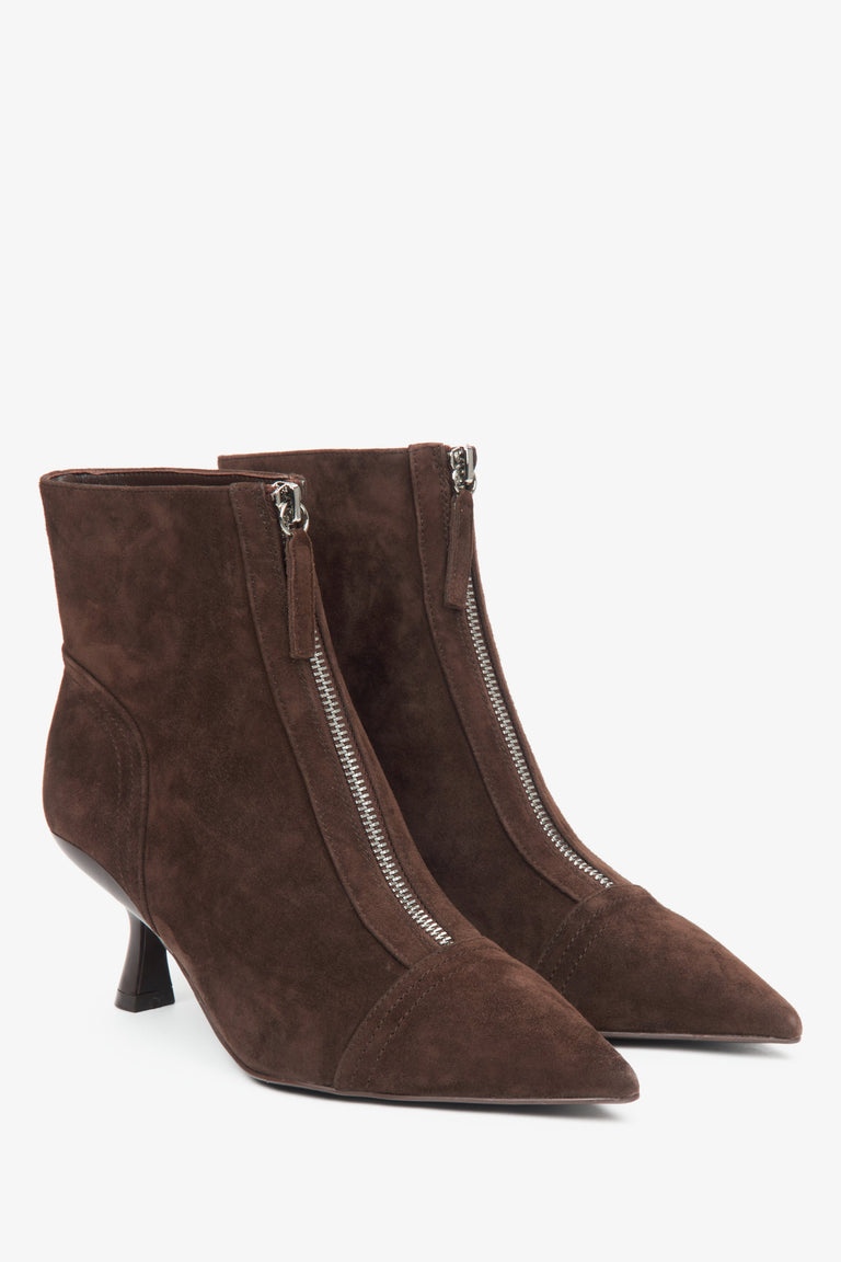 Dark brown women's ankle boots made of natural velour with a low stiletto heel by Estro.