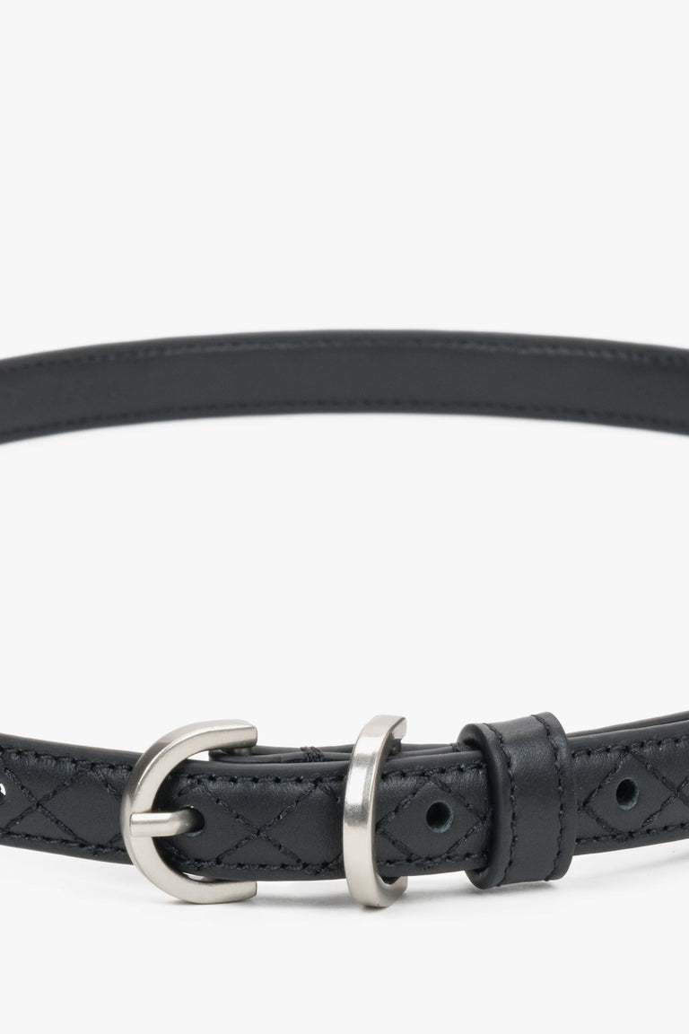 Thin black leather belt with embossed braided pattern.