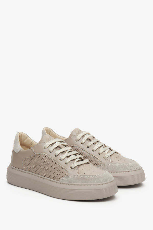 Women's beige sneakers made of genuine leather with perforation for fall by Estro - close-up on the toe and side seam of the shoe.