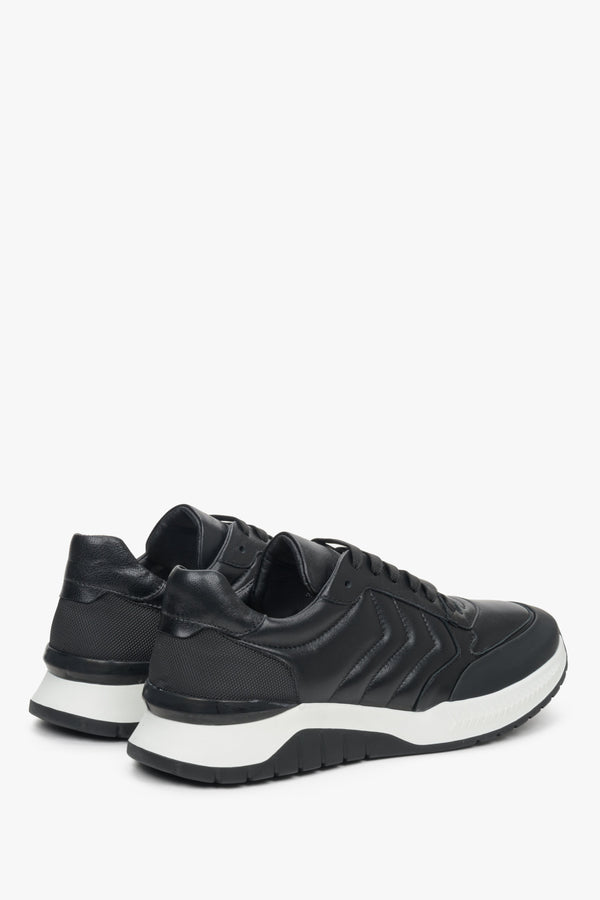 Men's black sneakers by Estro made of genuine leather - close-up on the heel and side seam.